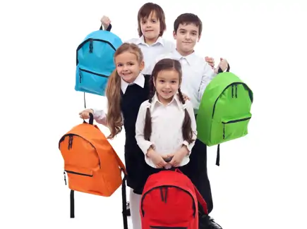 Children holding backpacks for back to school