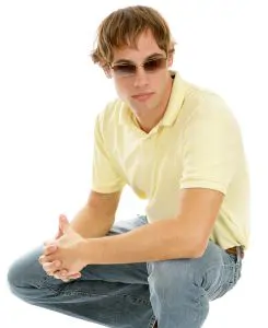 Man in casual clothing kneeling
