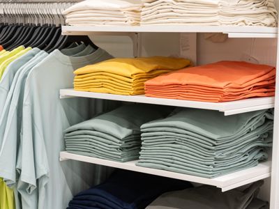 Clothing for purchase on hangers and shelves