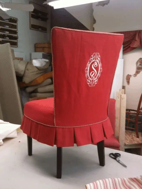 Embroidered S monogram on back of chair