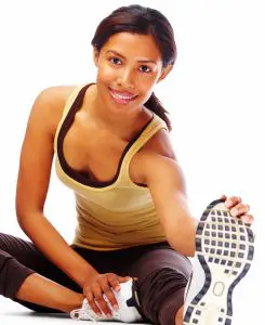 Woman in sports clothing stretching